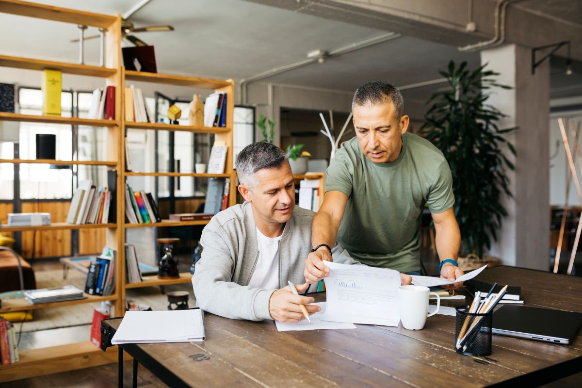 Two people looking into documents